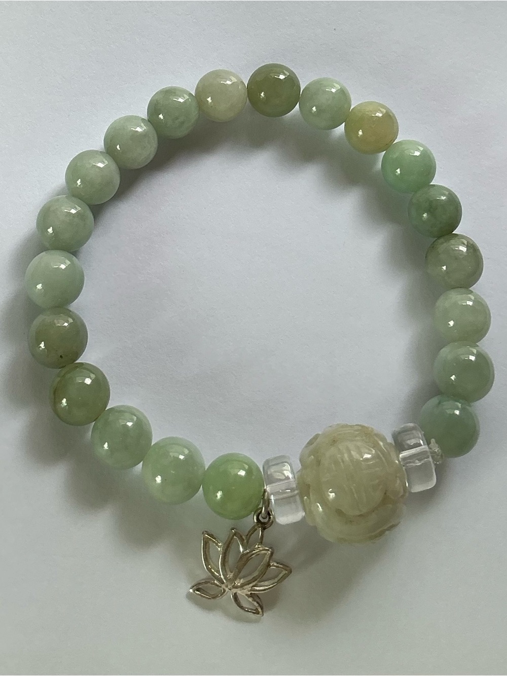 Hand Crafted Pale Green Jadeite Stretch Bead Bracelet with Lotus Charm .
